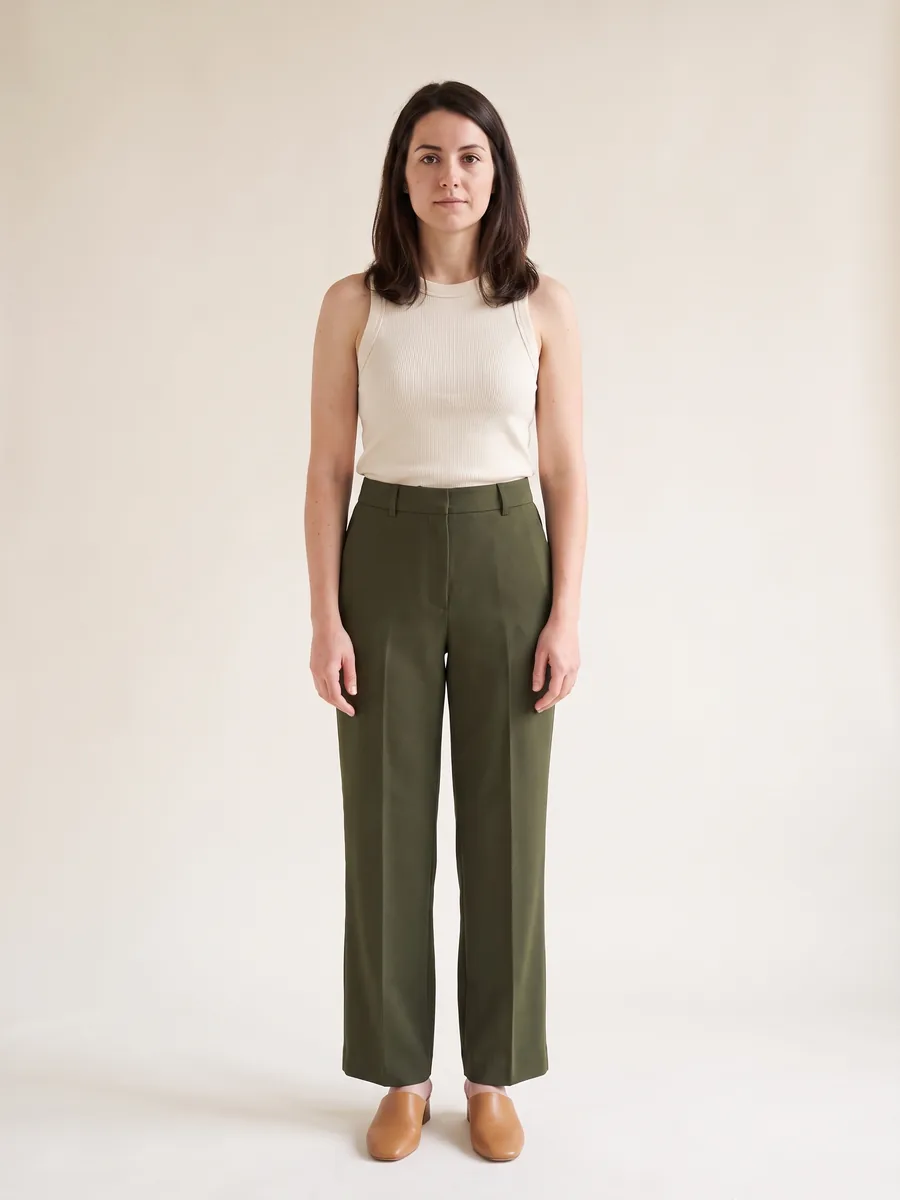The same shopper wearing the ribbed knit tank with the wide-leg trousers
